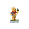 Disney Jim Shore "Luckey Ol' Bear" St. Patty's Pooh with Green Clovers and a Gold Pot 4.5" Figurine