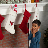 TheChild is happy that Elf on the Shelf® Tradition: Blue-Eyed Boy is on his stocking